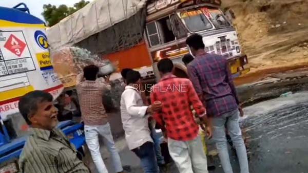 ಅಪಘಾತಕ್ಕೀಡಾದ ಪೆಟ್ರೋಲ್ ಟ್ಯಾಂಕರ್ - ಮುಗುಬಿದ್ದು ಪೆಟ್ರೋಲ್ ತುಂಬಿಕೊಳ್ಳುತ್ತಿರುವ ಸ್ಥಳೀಯರು