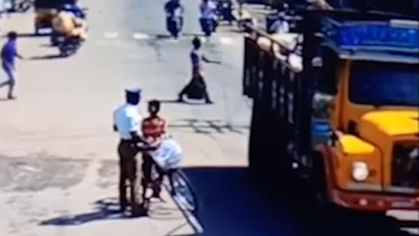 ಯಮರೂಪಿ ಟ್ರಕ್ನಿಂದ ಬಾಲಕನ ಪ್ರಾಣ ಉಳಿಸಿದ ಪೊಲೀಸಪ್ಪ..!