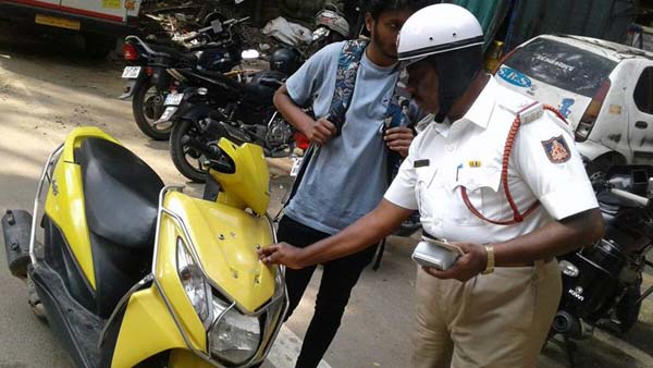 ಬೆಂಗಳೂರಿನಲ್ಲಿ ಎಲ್ಲರಿಗೂ ಒಂದೇ ನ್ಯಾಯ: ಹಾಫ್ ಹೆಲ್ಮೆಟ್ ಧರಿಸಿದ ಪೊಲೀಸ್ ಗೆ ಬಿತ್ತು ದಂಡ